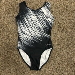 Quatro adult medium Leo.  Back and white with strappy back.